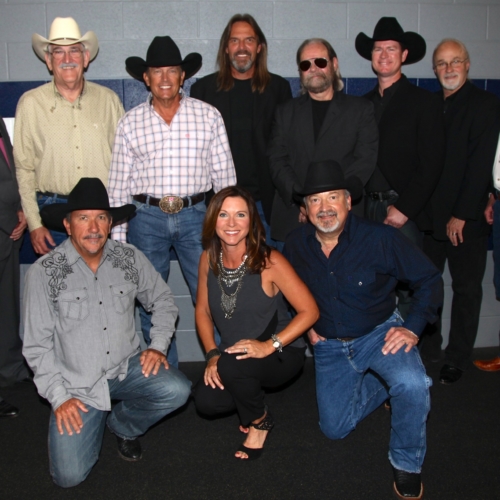 George Strait and the Ace in the Hole Band 2014: L to R Thom Flora, Ron Huckaby, Rick McRae, Mike Daily, George Strait, Marty Slayton, Mike Kennedy, Terry Hale, Joe Manuel, John Michael Whitby, Gene, Benny McArthur, Tom Foote